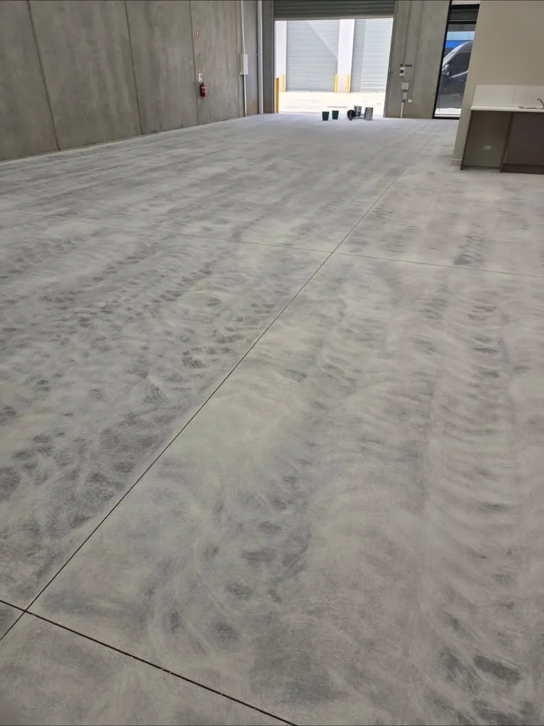 Raw ground concrete warehouse slab before coating